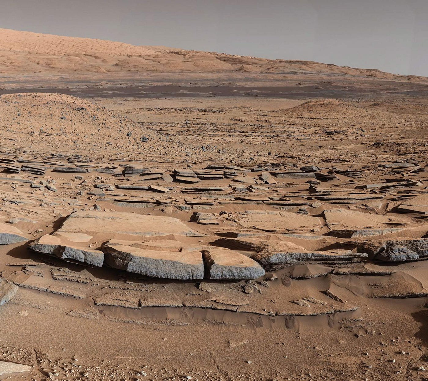 On Mars, bare-rock structures hold onto heat far better than sand-like structures do, meaning they will appear brighter at night, when viewed in the infrared. A variety of rock types and colors can be seen, as dust clings to some surfaces much better than others. In the reduced-gravity environment of Mars, the human body will no doubt behave differently than it does either in zero-gravity or Earth-gravity environments, although we are not sure in what ways or by how much. (Credit: NASA/JPL-Caltech/MSSS, Mars Curiosity Rover)