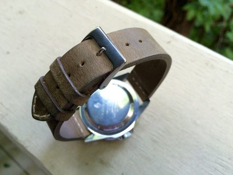 Check this out:Brown leather strap with buckle