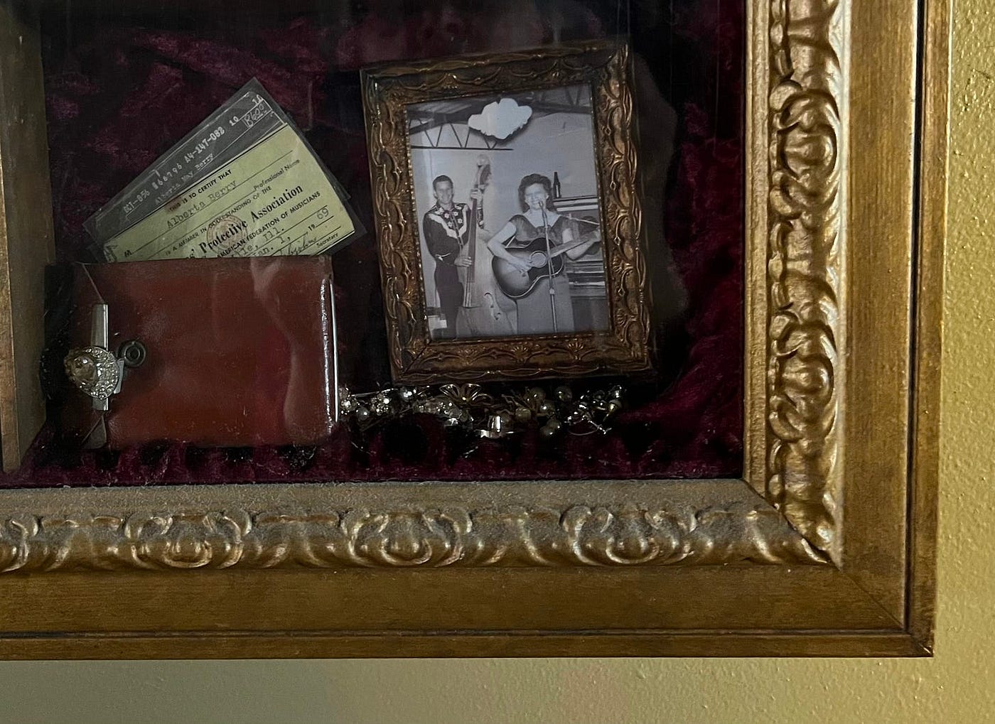 My sister designed a shadowbox to hold some family memorabilia. My mother’s family was musical and used to host bluegrass jams in their dining room. In this section, we see that Grandma Berry was a member in good standing of the musicians’ union in 1969. In the pictures, she’s playing a Hummingbird guitar and Grandpa is playing the bass. (Photo by Michelle Teheux)
