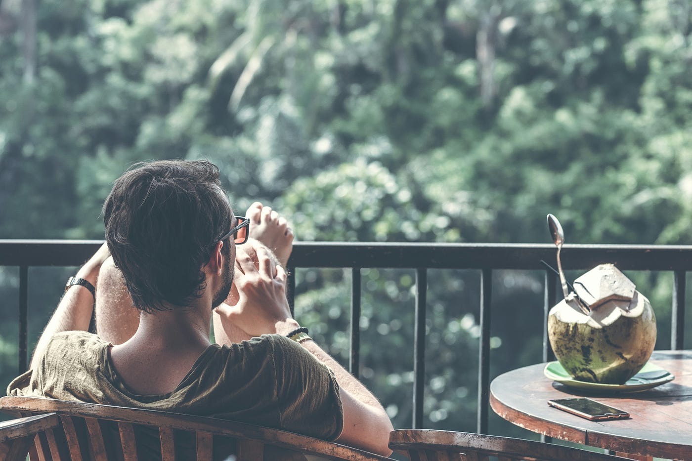 man relaxing as easy fiverr gig does all the work in the background thanks to automation and AI