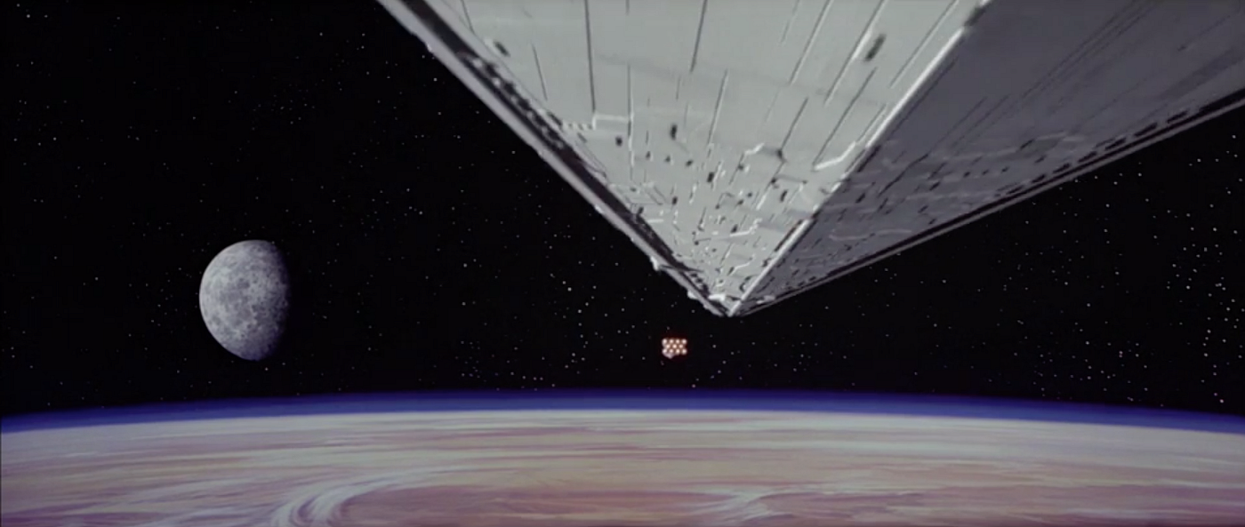 Rebel cruiser running from the Imperial Star Destroyer, from the opening of “Star Wars, Ep 4”. Dir. George Lucas. © 1977 Lucasfilm Ltd.