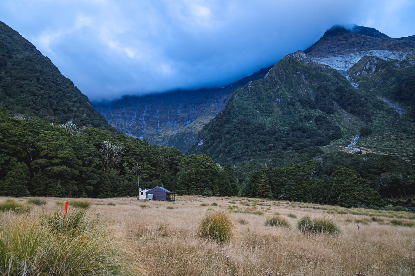 waterfall valley new zealand steep torrent group mountain blue