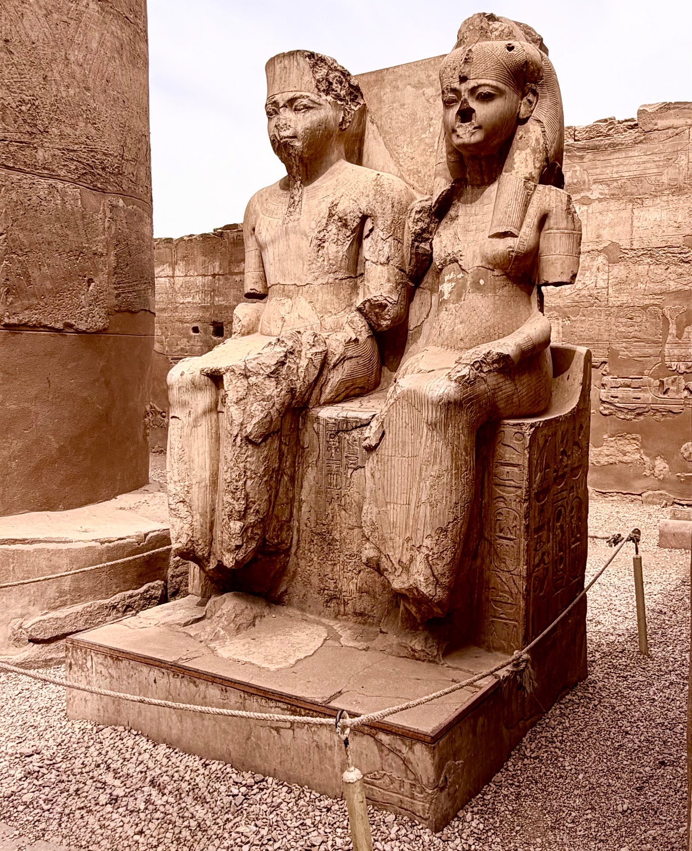 Left: Rameses II Courtyard of papyrus bud columns. Right: Amun and Mut with the facial features of Tutankhamun and Ankhesenamun. Photos: David A. Laws