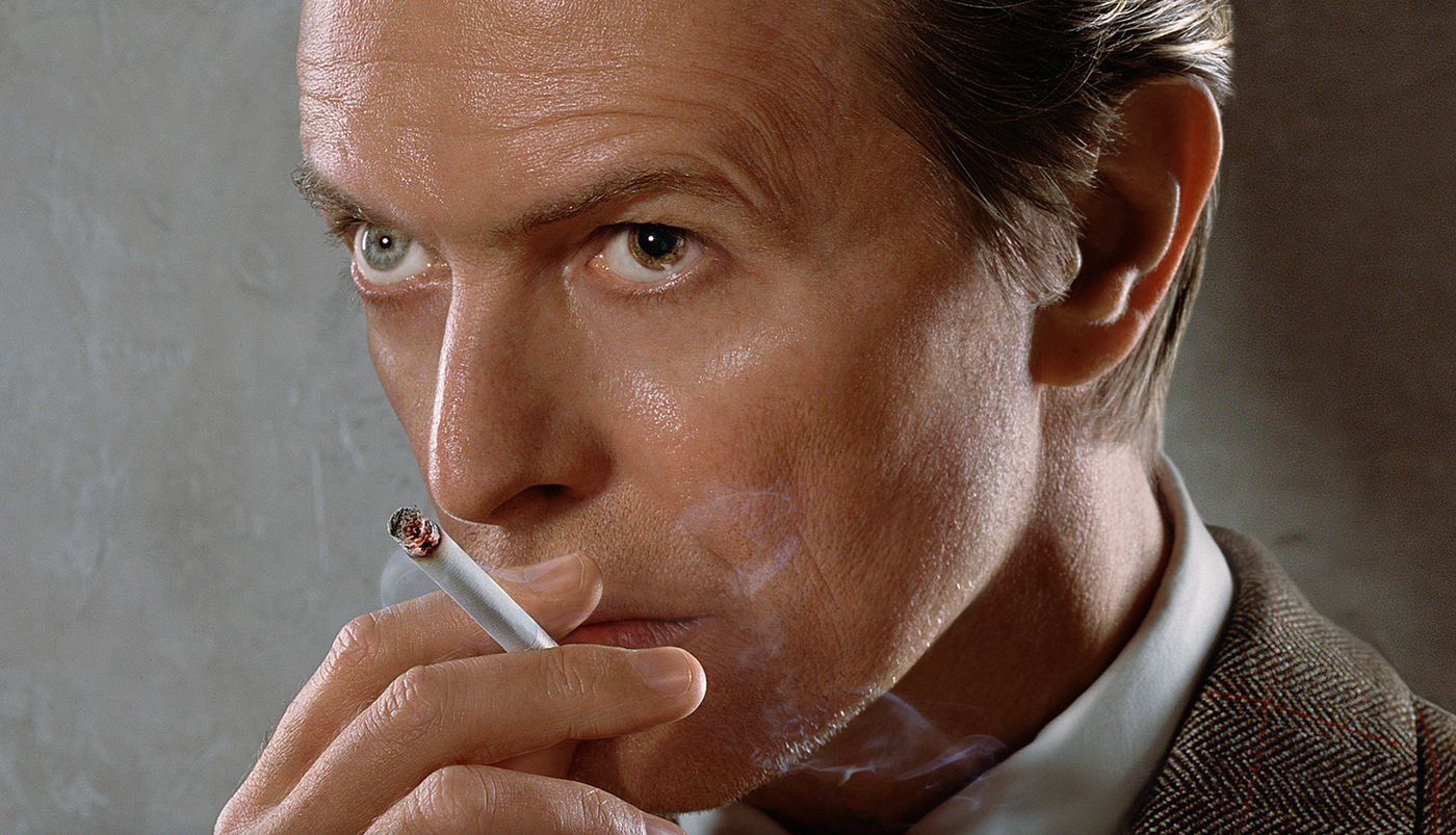 david bowie smoking a cigarette Bowie's suit with burns only fetches 8k Lighting a Cigarette for David
