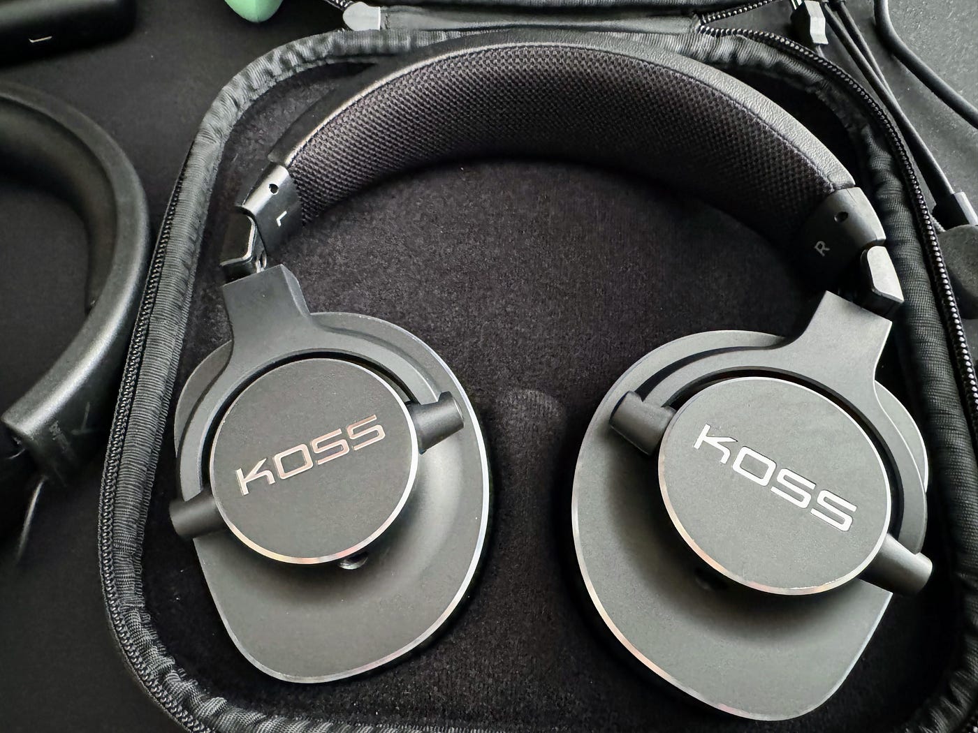 The Koss headphones come with a hard case, which is nice. Photo taken by the author.