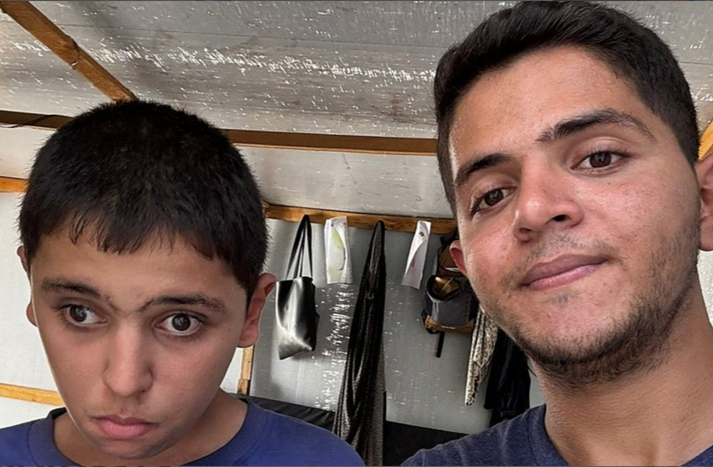 A picture of Abood (on the left) and Hammam (on the right) inside a tent