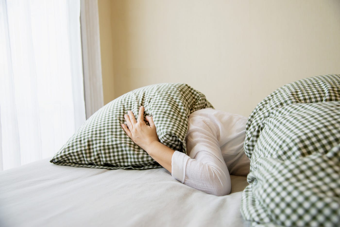 A 2-in-1 pillow that lets you sleep on your bed or at your desk