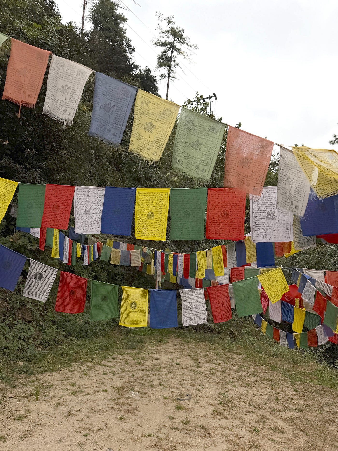 Prayer flags cover hillsides, mountain passes and bridges. Credit: Marybeth Bond