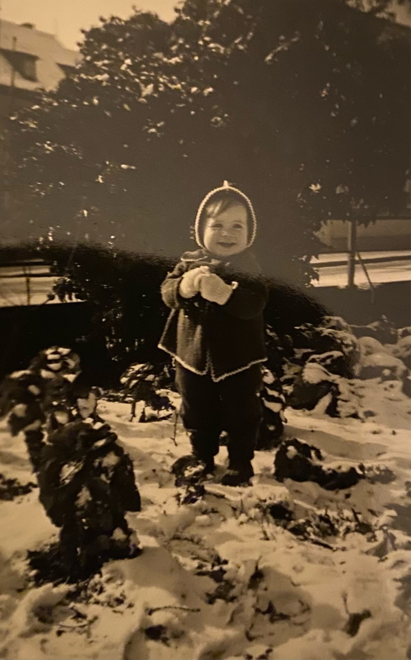 Author’s photo of “me” playing in the snowy garden in Neustadt, Germany.