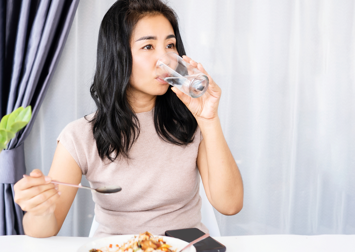 Drinking water before meals helps reduce the amount of food eaten