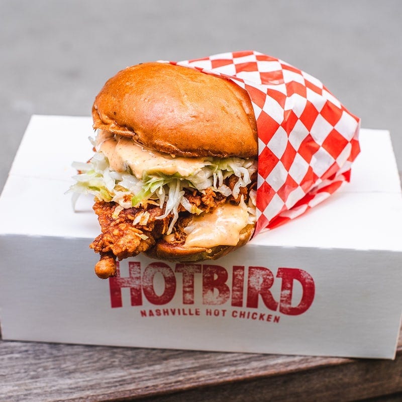 A chicken sandwich on a box that says “Hotbird.”