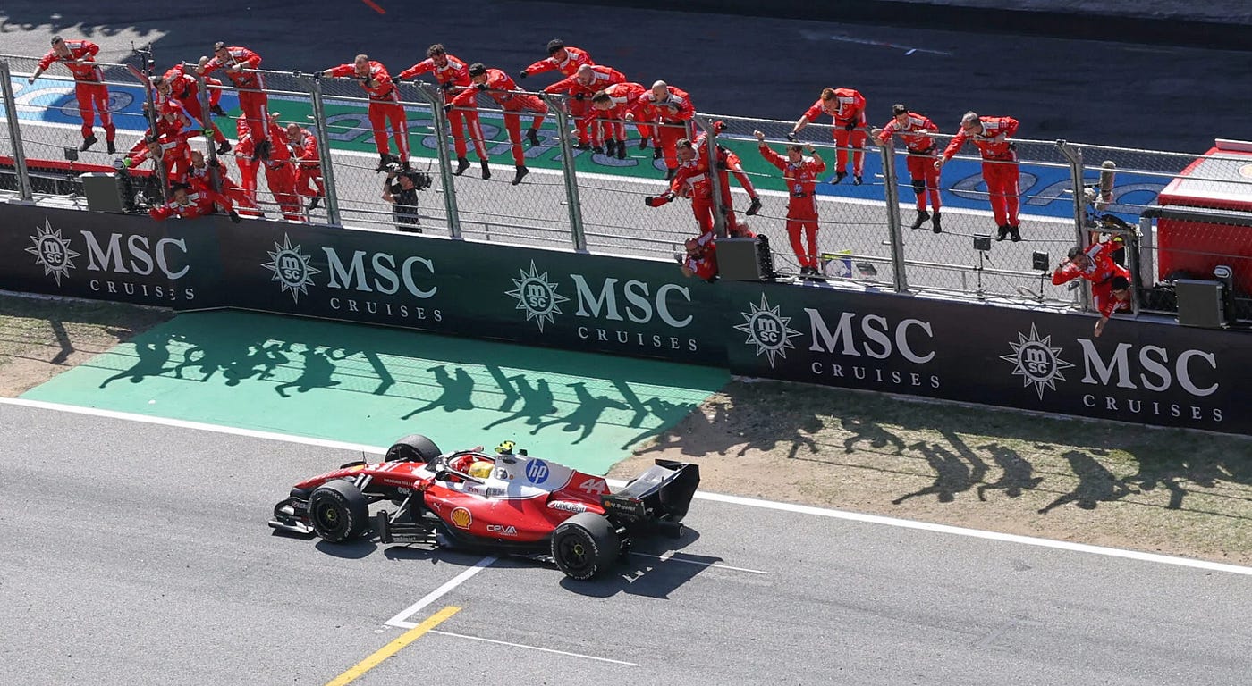 Lewis Hamilton with the ferrari team as he is set to cross the finish line. Image via SoyMotor.