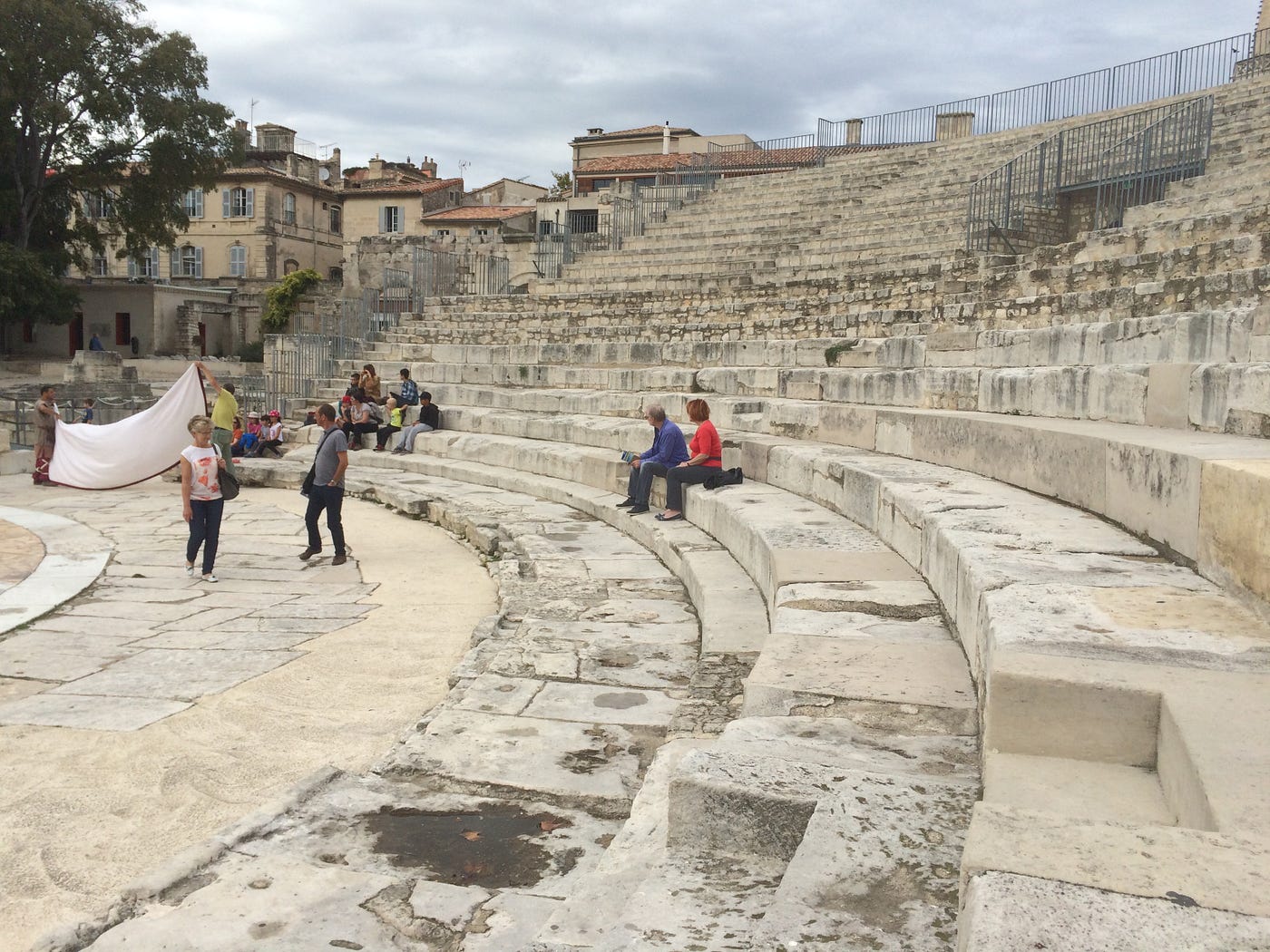 Photo of a semi-circular Roman ampetheater in Arles, France