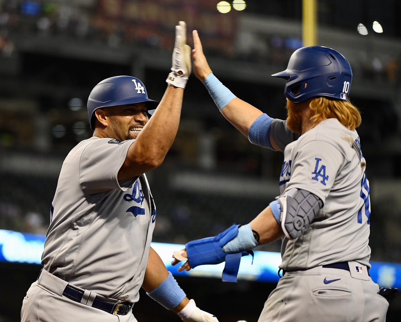 Pujols continues his surge vs. lefties as Dodgers hold on to sweep