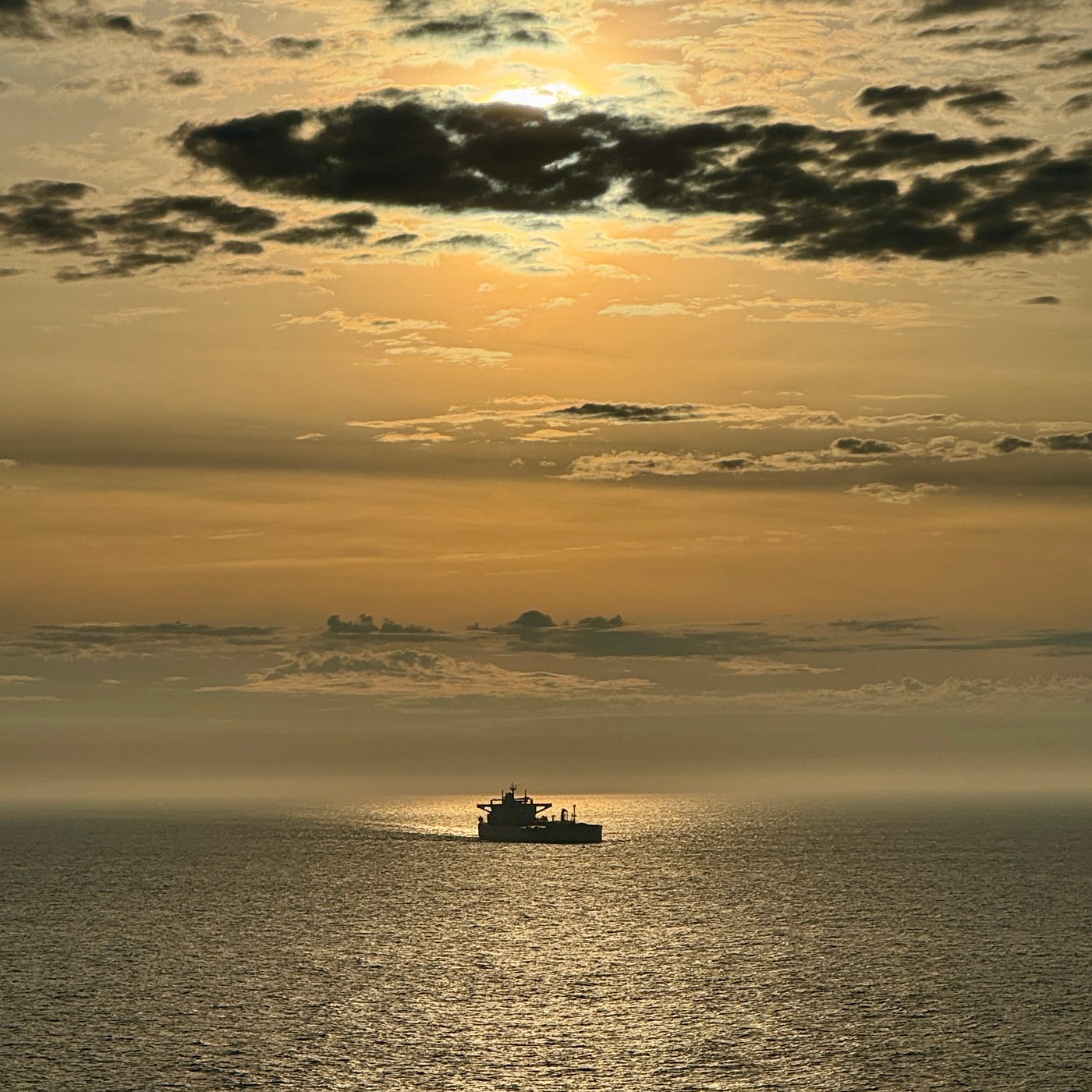When I looked out across the water, I saw a fuel tanker. Its silhouette looked exaggerated by the direction of the sun.