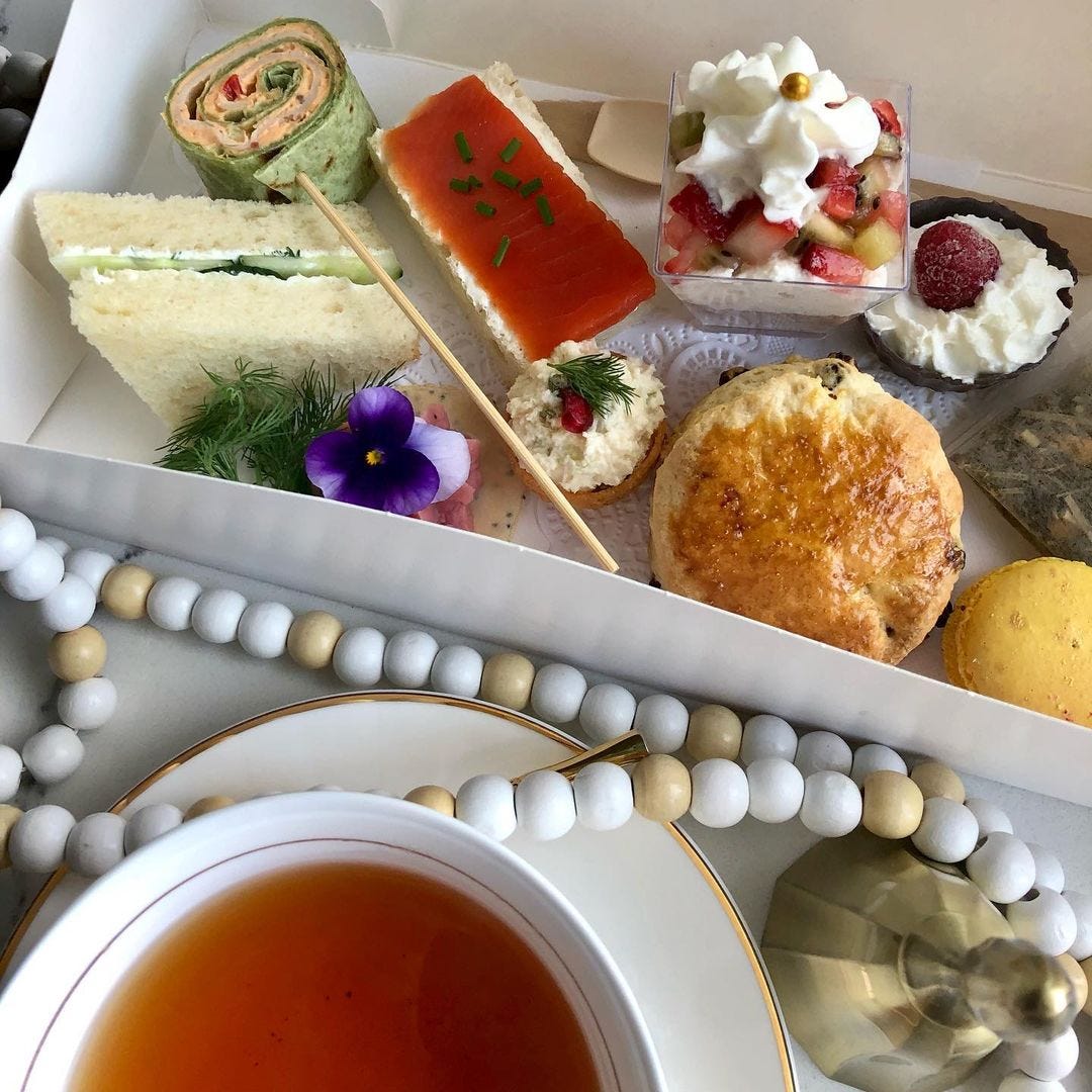 A Holiday Tea in a Vox with tea sandwiches, scones, canapes, desserts, and tea.