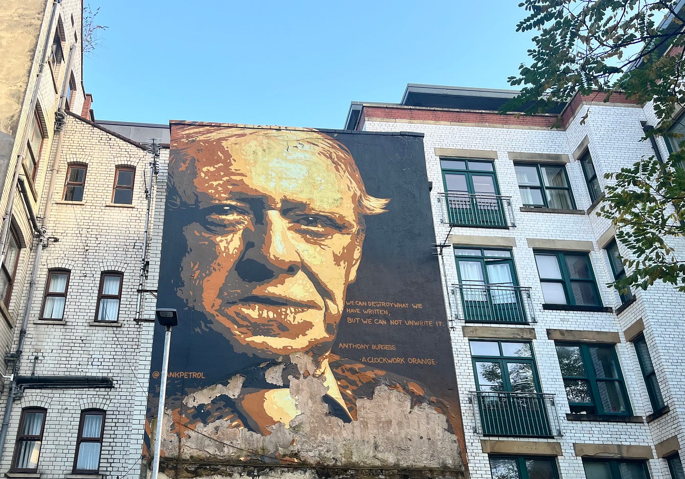 TankPetrol’s depiction of Manchester’s own Anthony Burgess among apartment windows.