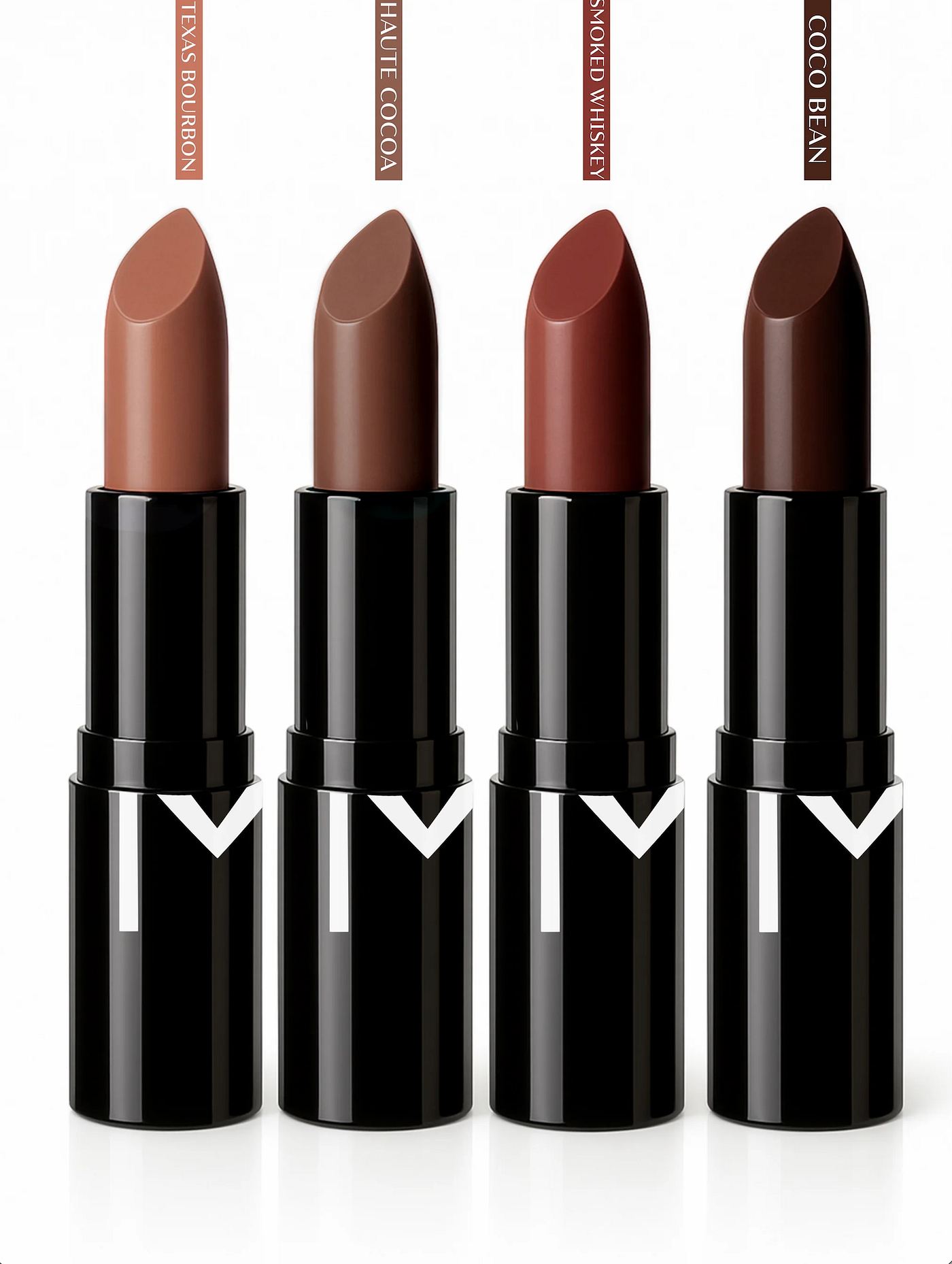 Four velvet-finish lipsticks from the Just Four You collection displayed in a row, showcasing the shades Texas Bourbon (warm nude taupe), Haute Cocoa (rich chocolate brown), Smokewhiskey (deep burgundy), and Cocoa Bean (dark chocolate brown). Each lipstick features a sleek black tube with a white chevron logo detail and a polished black cap, highlighting the creamy, buildable pigment and luxurious velvet finish of each universally flattering shade.