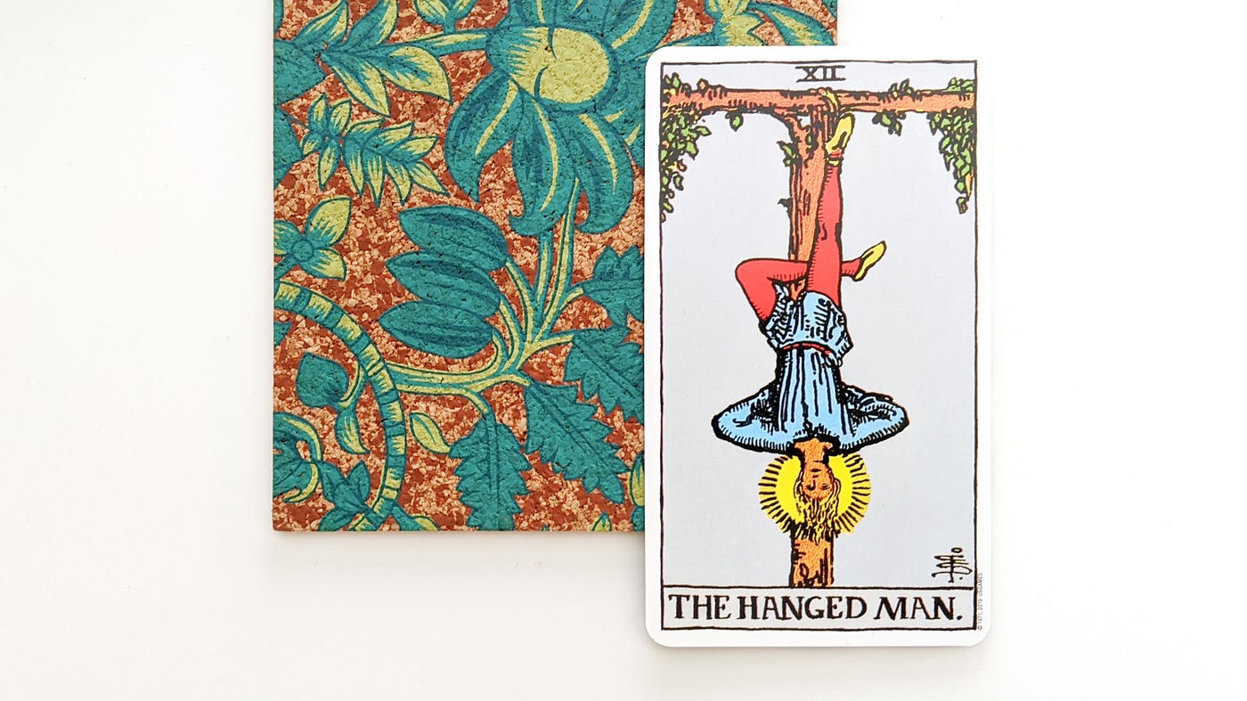The Hanged Man: Pause for Perspective | by Tarot Stories | Medium