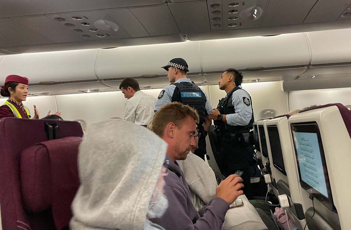 Left: The loud policeman negotiating with the elderly gentleman. Right: Crew and police trying to convince the lady to leave. Photos taken by Author