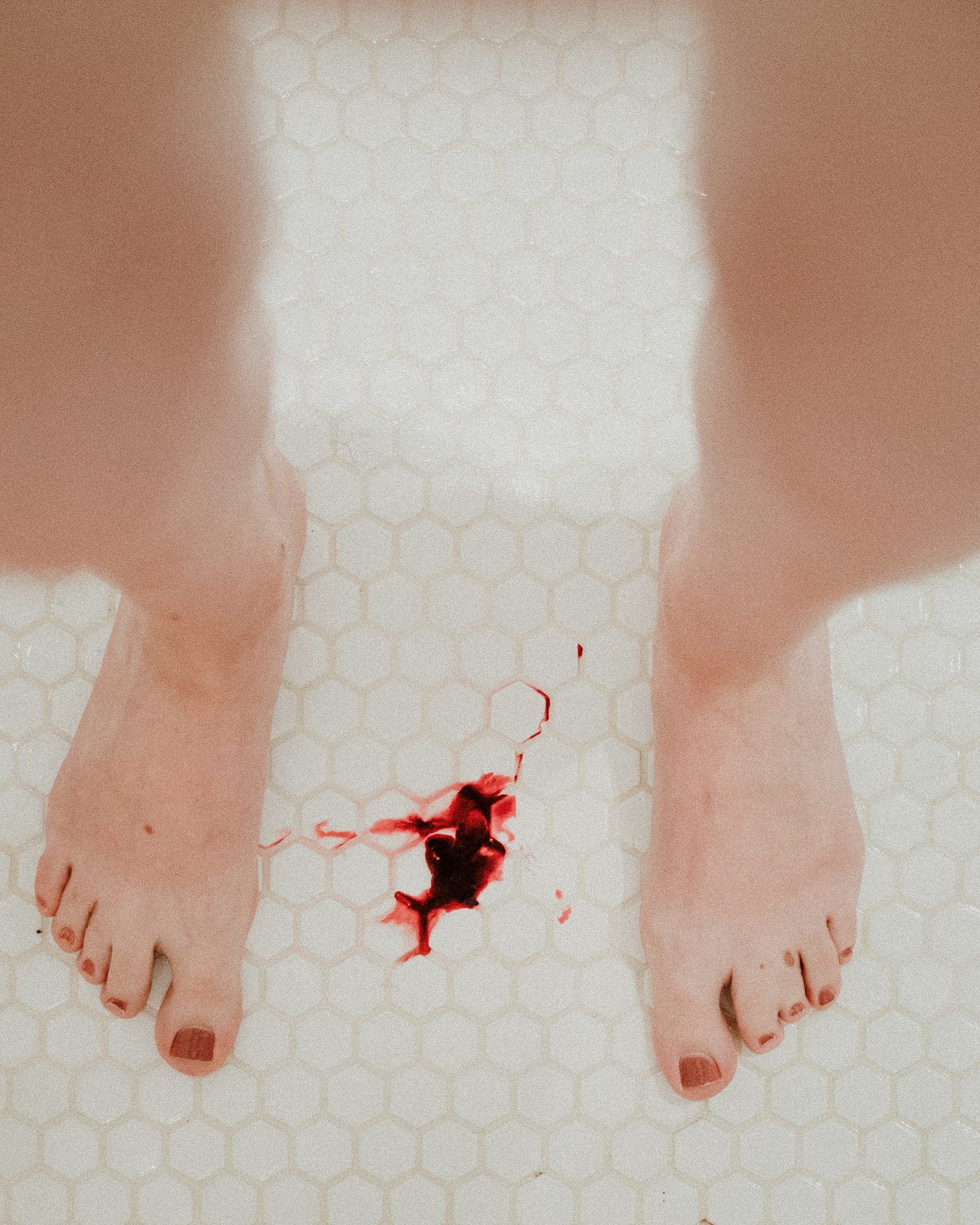 A woman laying on a bed wearing a white underwear photo – Menstrual blood  Image on Unsplash