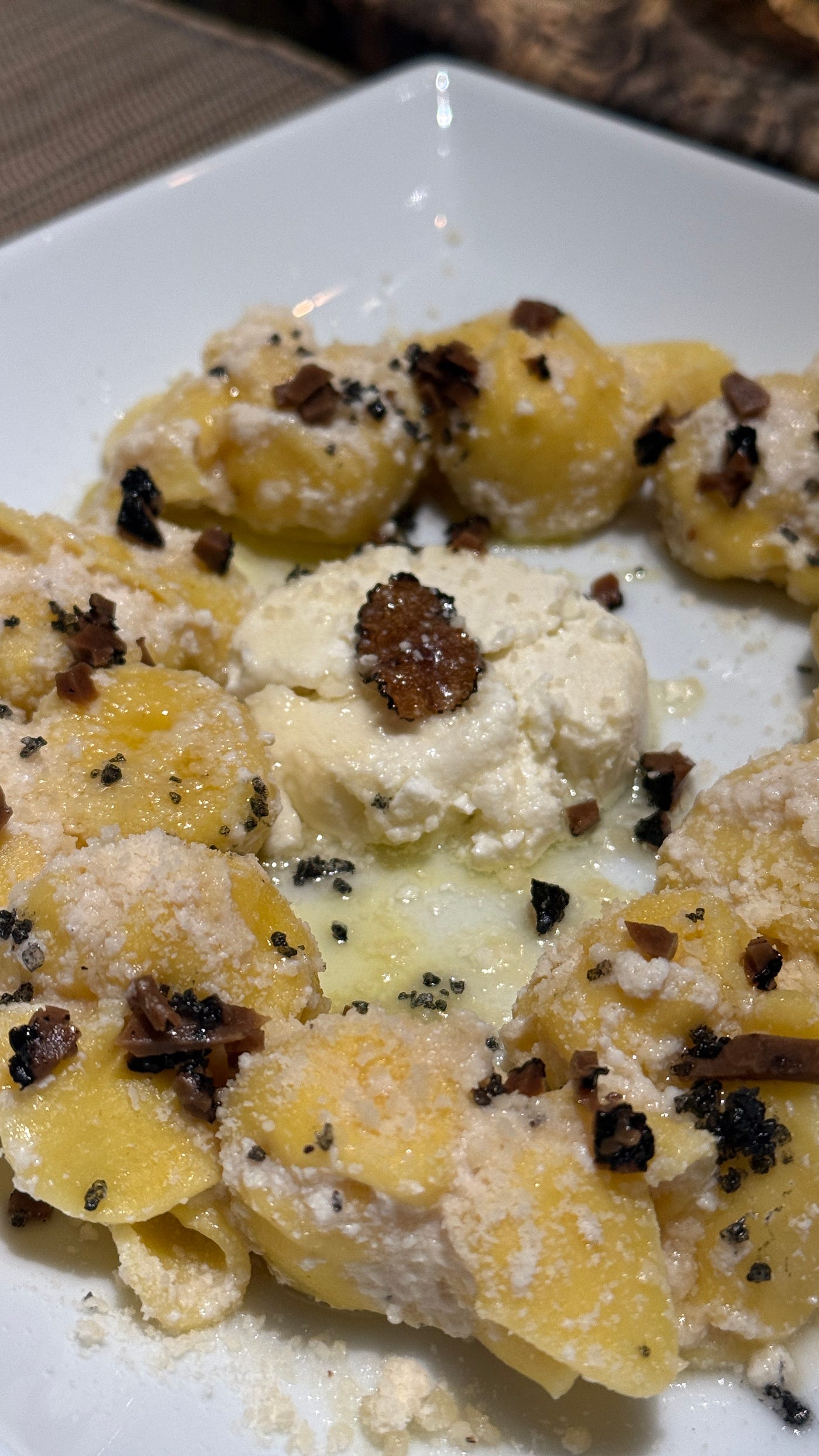 Honeyed sacchetti with goat cheese, truffle, and mead vinegar — the finale, where comfort meets quiet luxury.