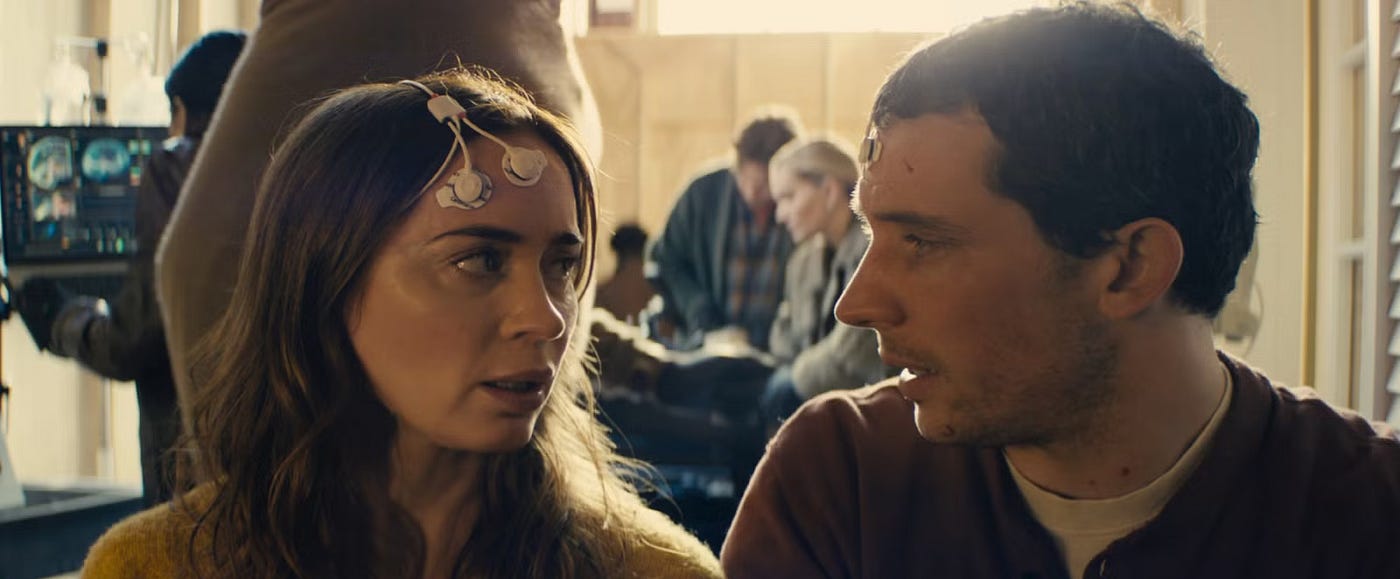 The eyes are the window to the soul, as Noah (Colin Firth) discovers in remote viewing, while Margaret (Emily Blunt) and Daniel (Josh O’Connor) remember the depth of their bond. (Credit: Universal Pictures)