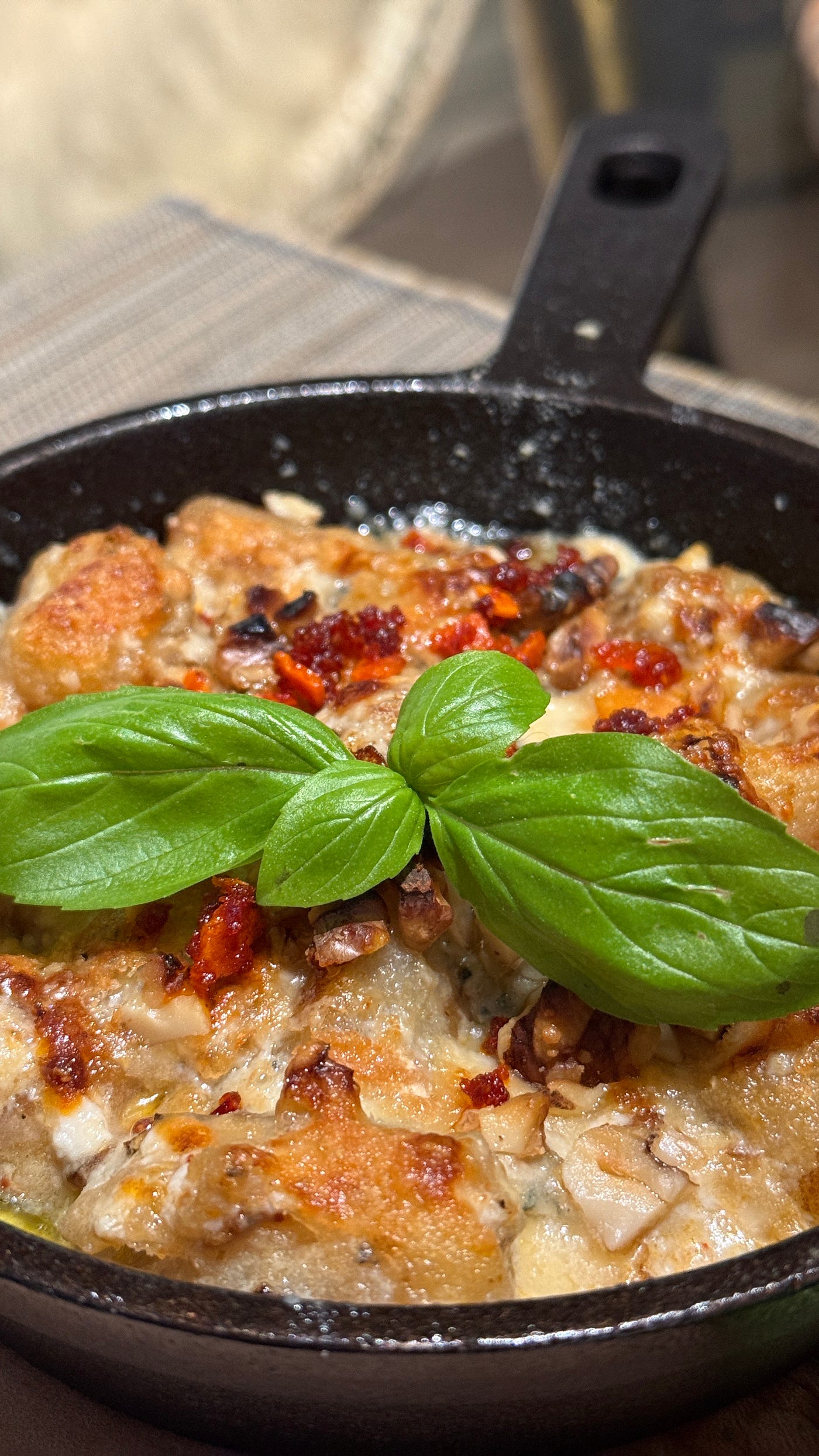 Buffalo-style cauliflower gnocchi with Gorgonzola, walnuts, and a touch of chili oil — day one of flavor evolution.