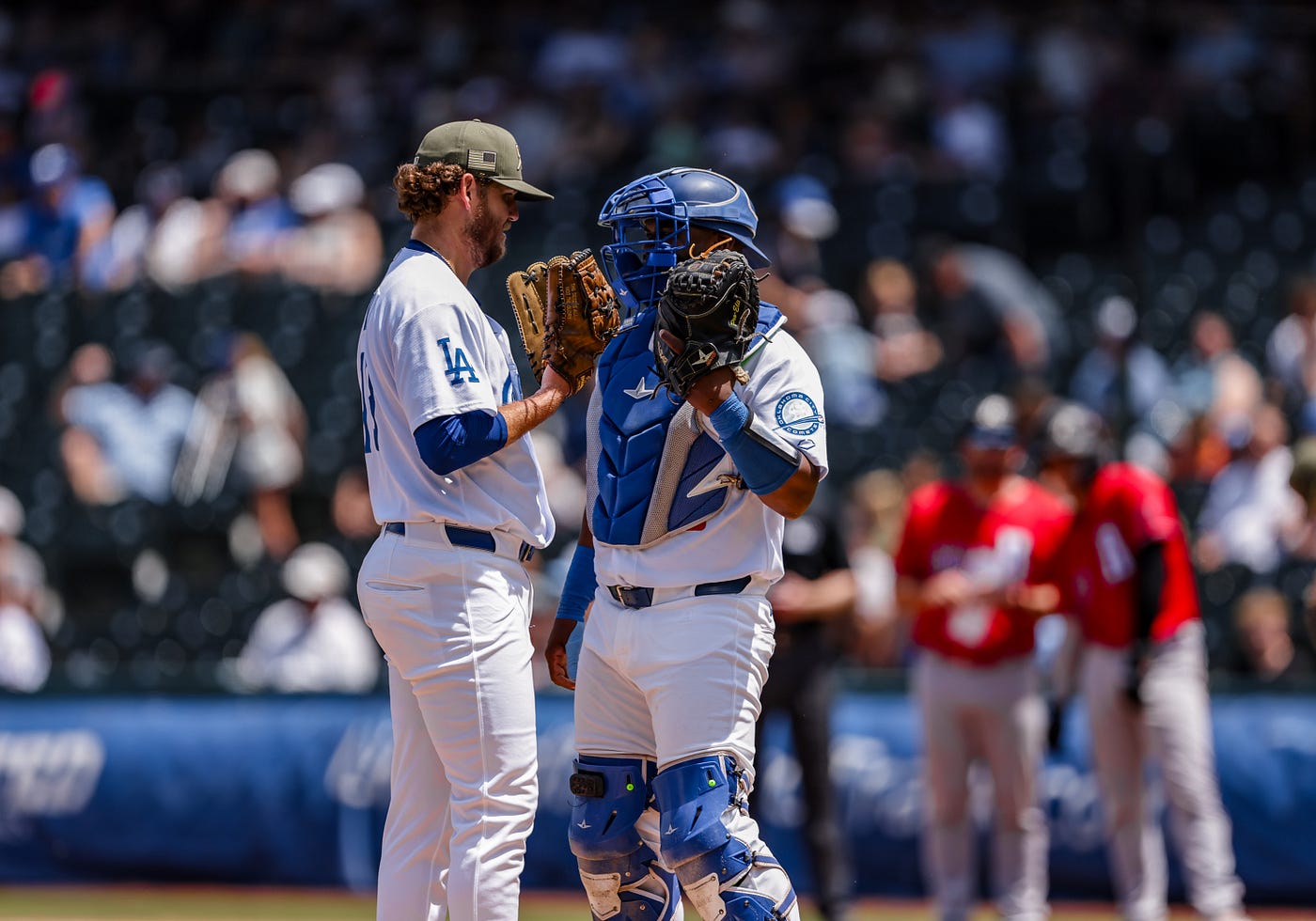 Cole Irvin chatting with catcher Chuckie Robinson during a mound visit (Ron Lane).