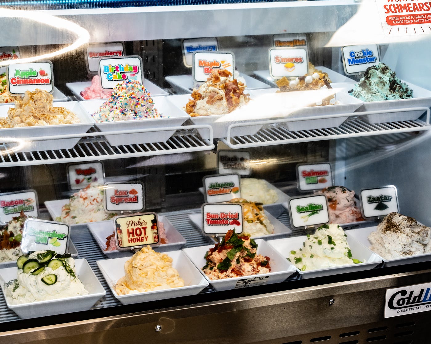 Bagels & Co. offers a large variety of schmear flavors including bacon scallion, Mike’s Hot Honey, cucumber dill, apple cinnamon, birthday cake, strawberry, sun-dried tomato, s’mores and Cookie Monster. (Credit: Michael Murphy)