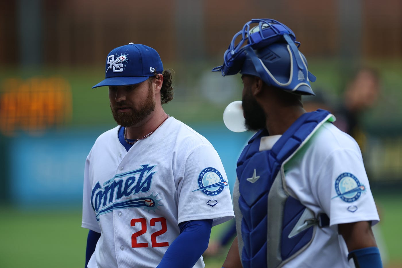 Logan Allen and Chuckie Robinson walking back to the OKC dugout (Eddie Kelly).