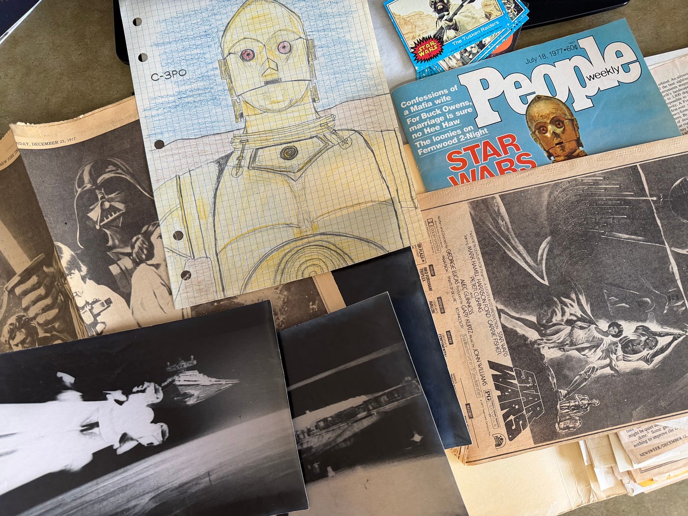 1977 kid fan stuff — my clippings, articles, photos taken in theaters (I traded for them), a little C3PO-fan-art…