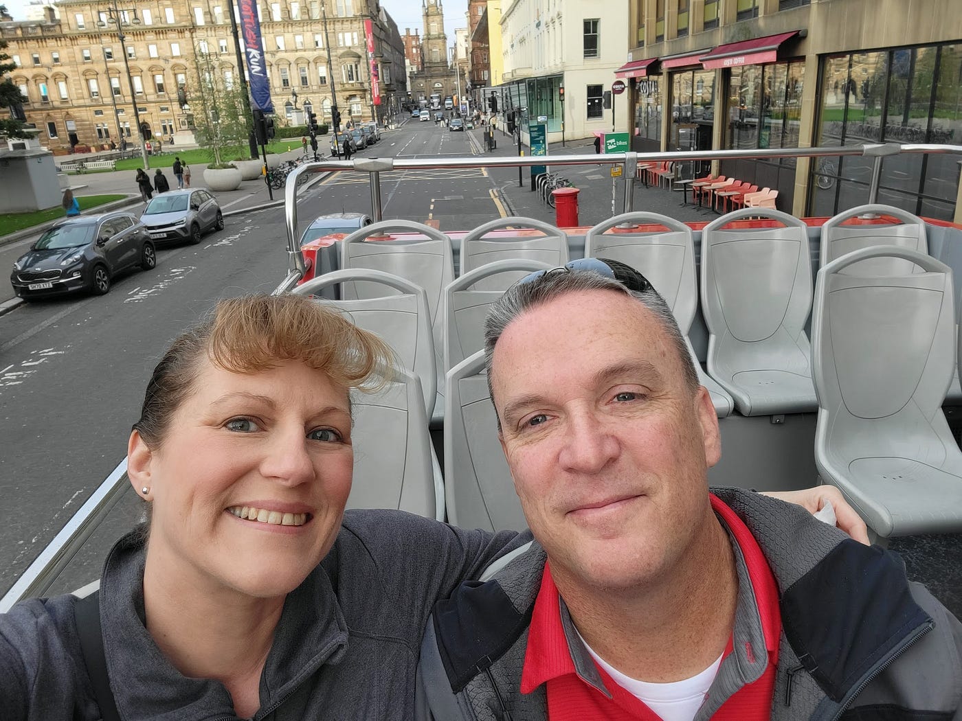 Us on the top of an open air bus