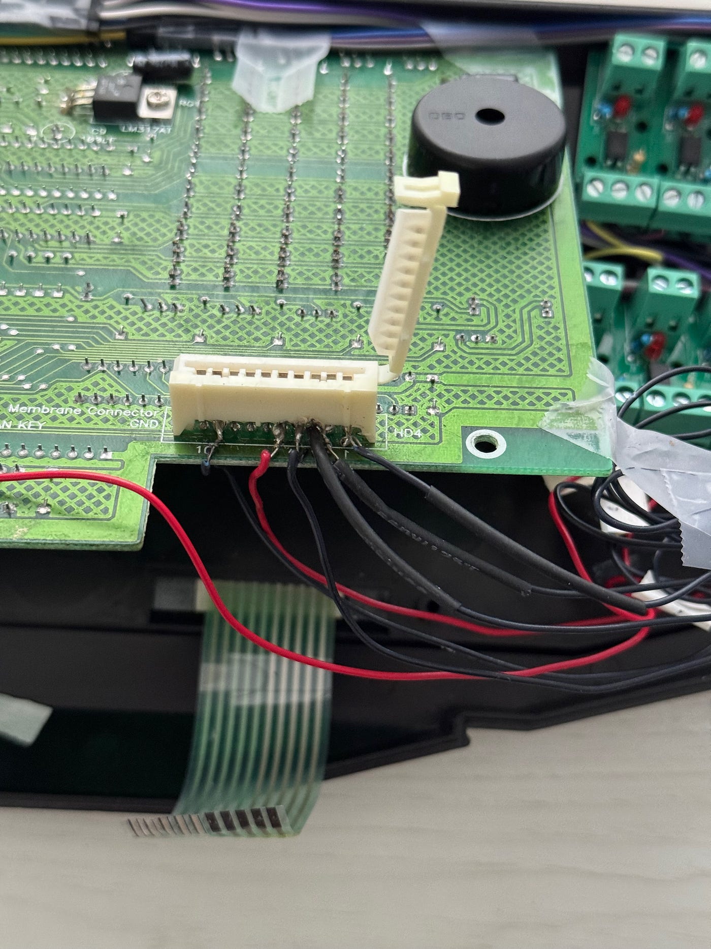 Hack job hacking into the keyboard — horrible soldering & melted connector
