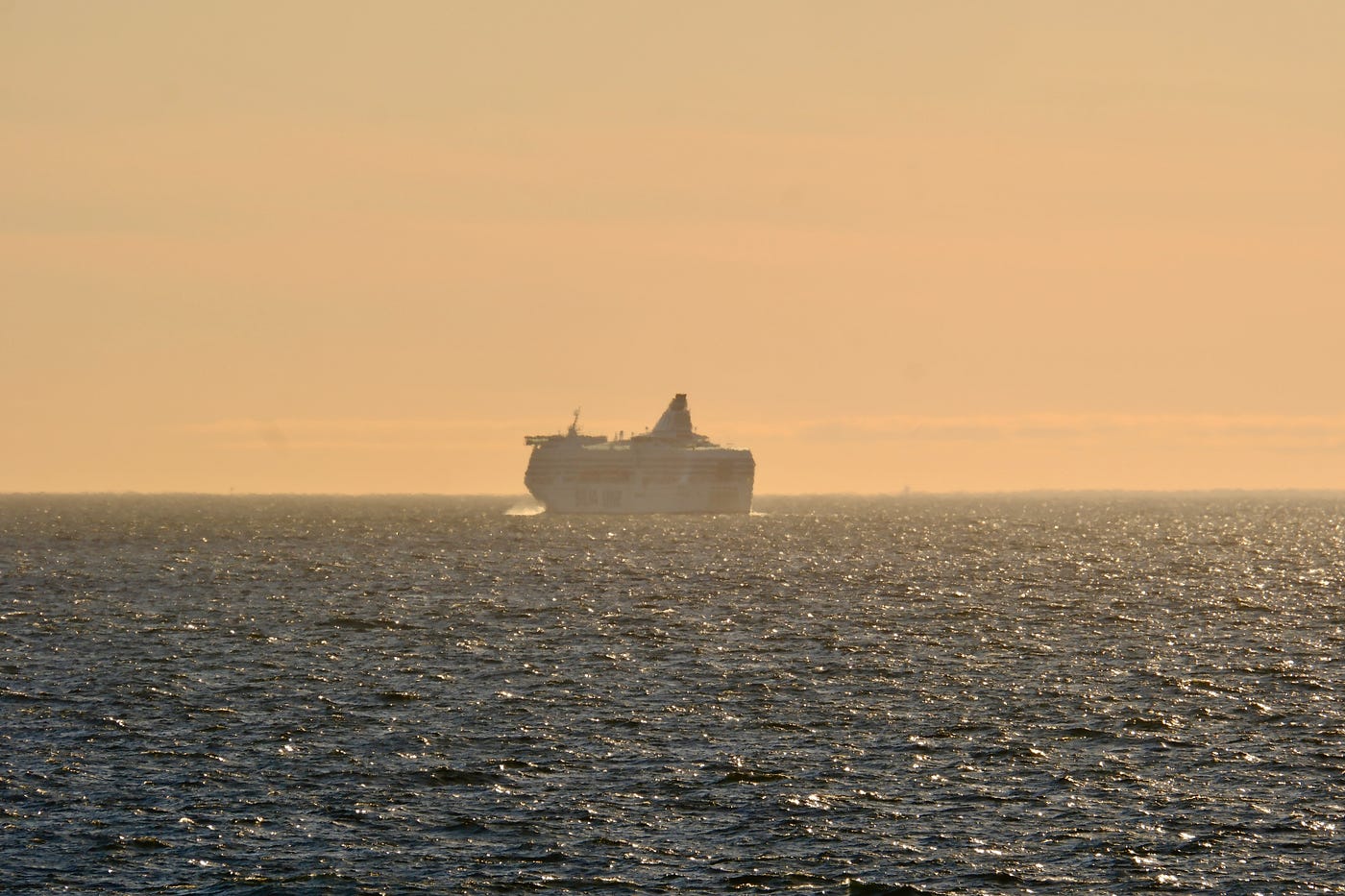 A regional cruise ferry seen in the distance.