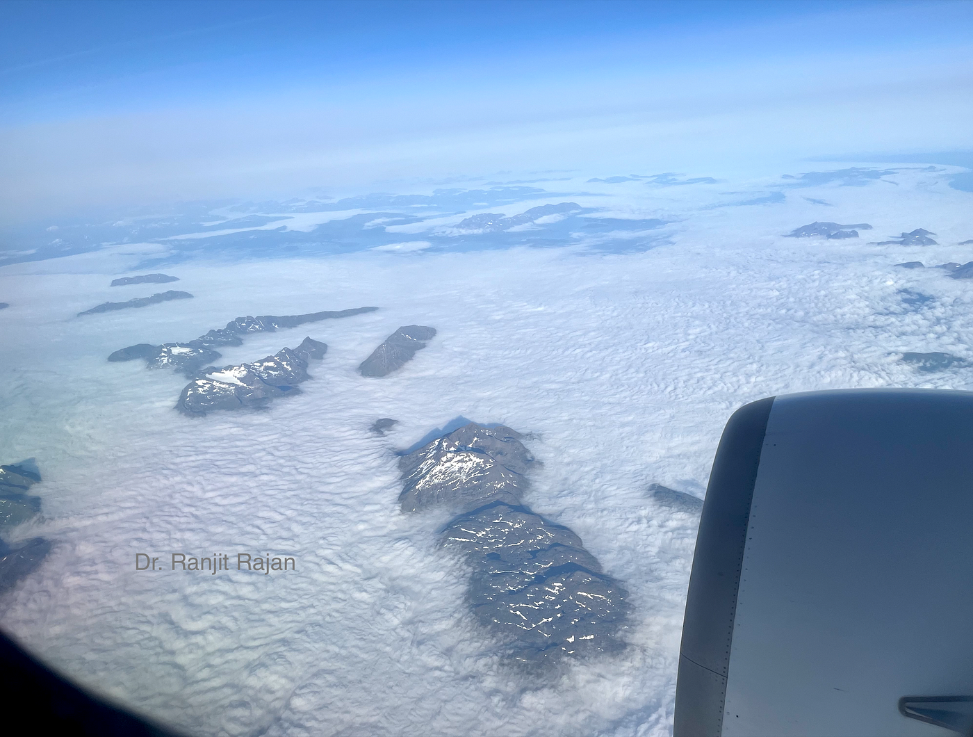 Mountain peaks seen projecting above the thick clouds
