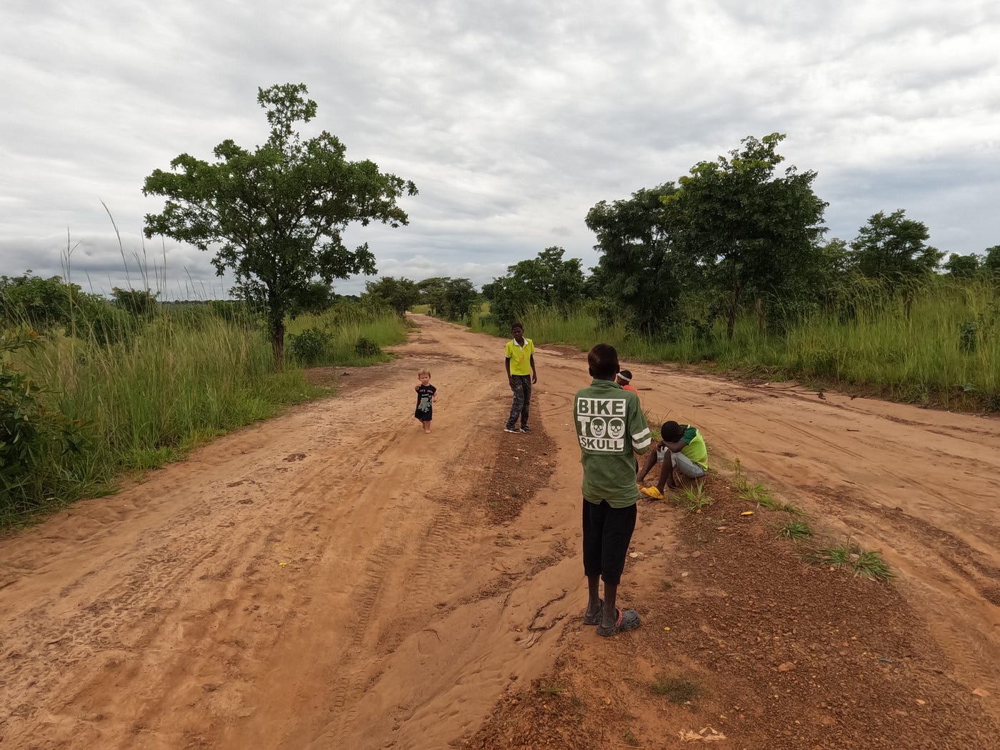 Eric and the local boys on their way to the fields. | Photo credit: Anne Bonfert