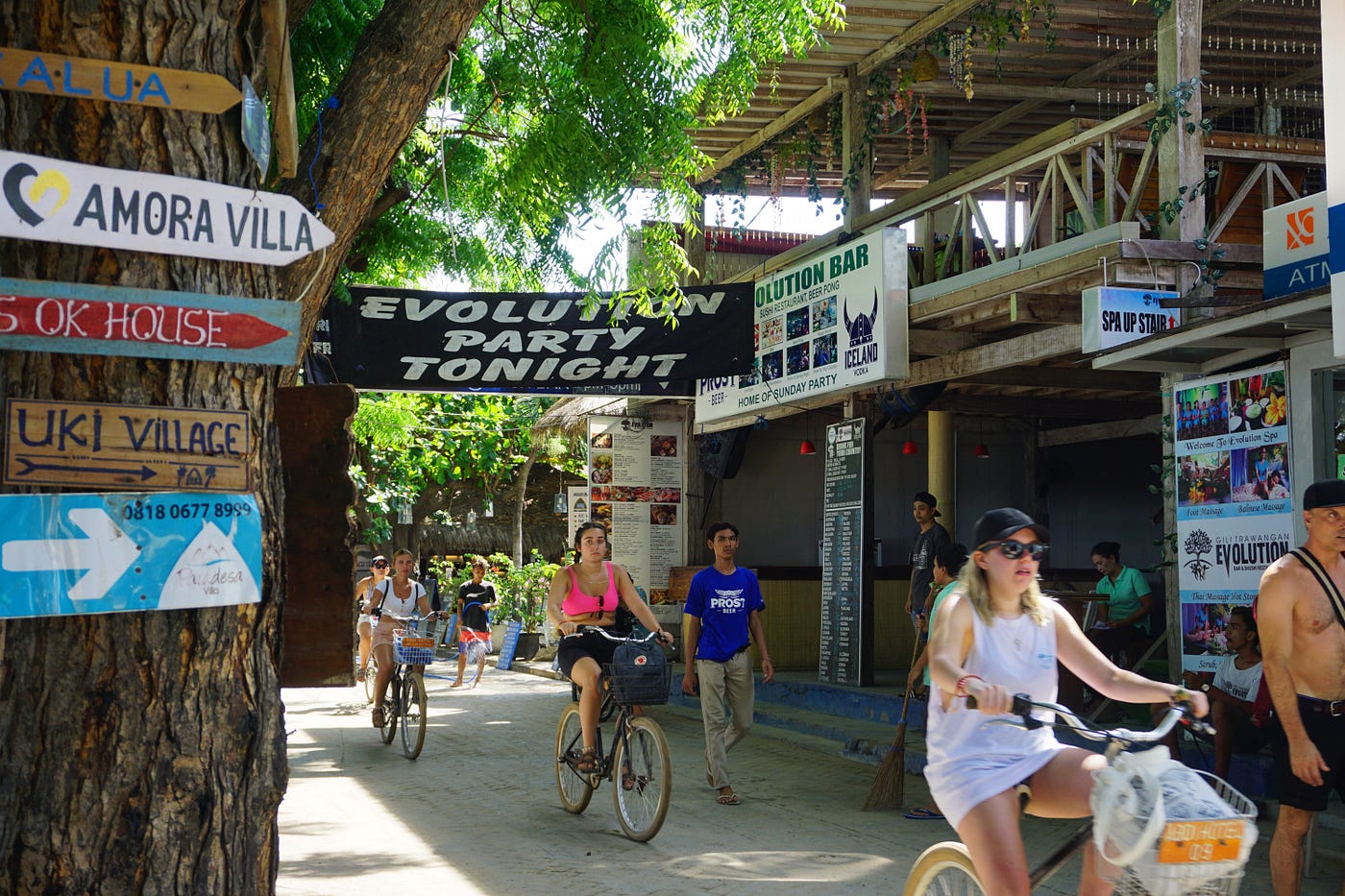 Tourists riding bicycles on Gili Trawangan, embracing the car-free lifestyle