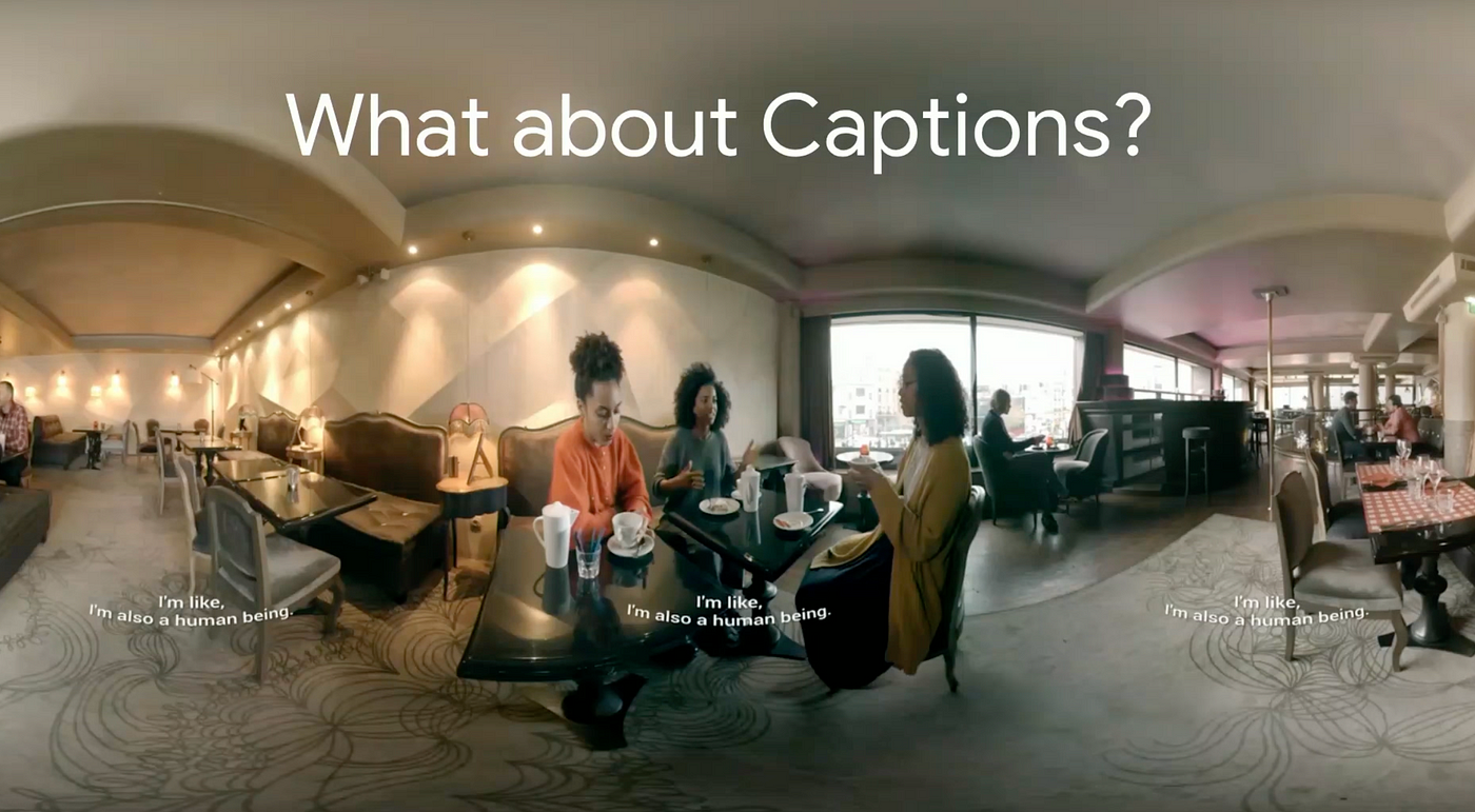 360 photo of three woman talking in a restaruant. Closed Captions can be read in the center of the screen as well as on the sides