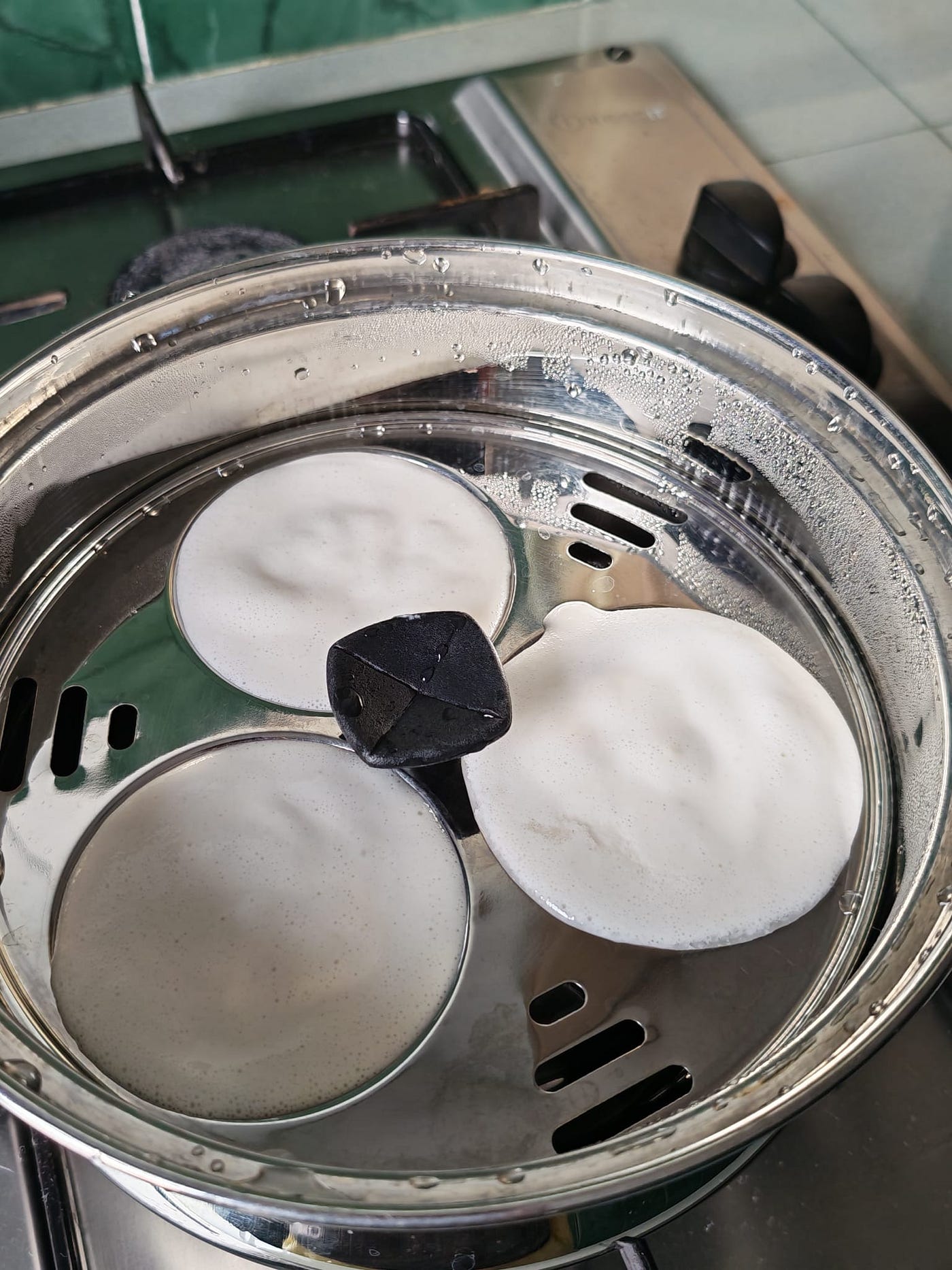 Steaming in progress! Realised too late that I forgot to add a bit of oil to the base of the metal pan. It probably wasn’t wise to open the lid during the steaming stage (Photo credit: Cuifen Pui)
