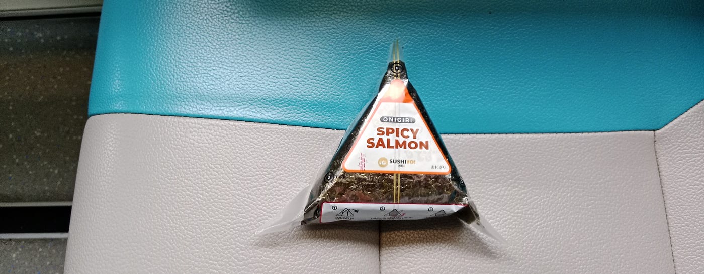 A spicy salmon onigiri as semi-lunch.