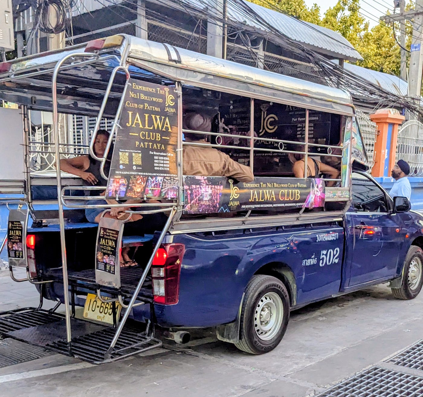 A "baht bus"—officially known as a songthaew—is a shared, open-air pickup truck taxi that serves as the backbone of public transportation in cities like Pattaya. Local lore says it did indeed cost a single baht at one time. It’s been 10 baht a trip for as long as I can remember. Just recently it was increased to 15 baht.