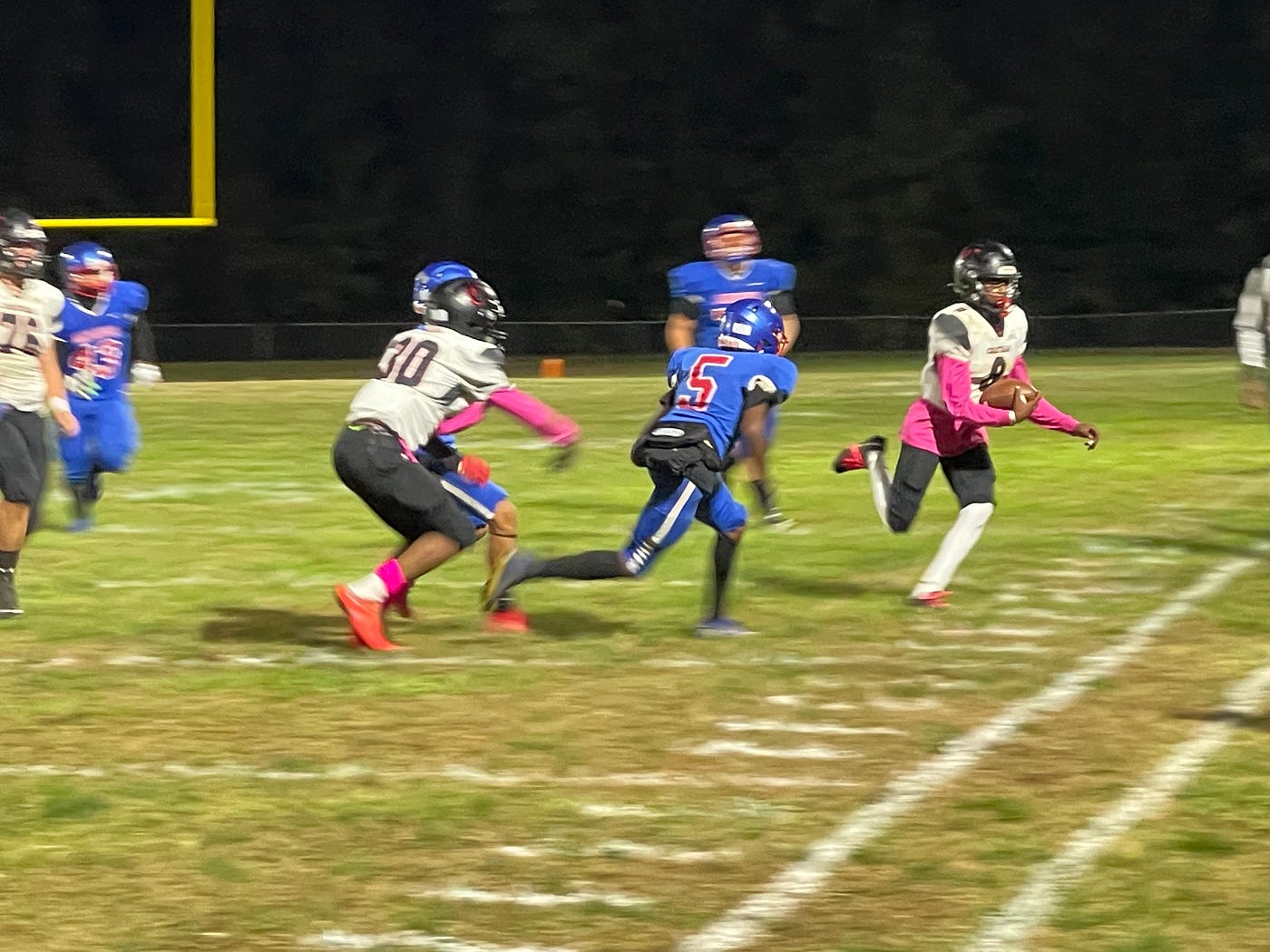Chatham sophomore quarterback Amare Word (8) runs out of bounds after a gain against the Wildcats Friday evening. PHOTO: Davin Wilson/River City Sports.