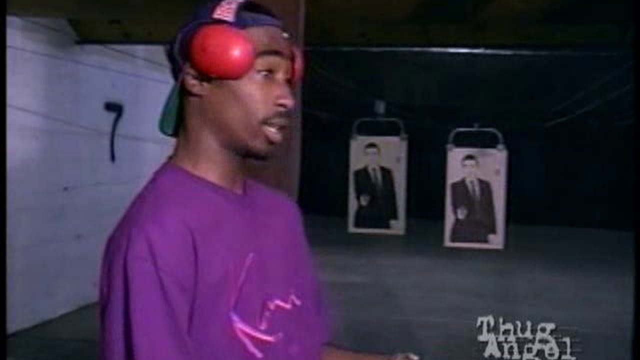 tupac pointing gun
