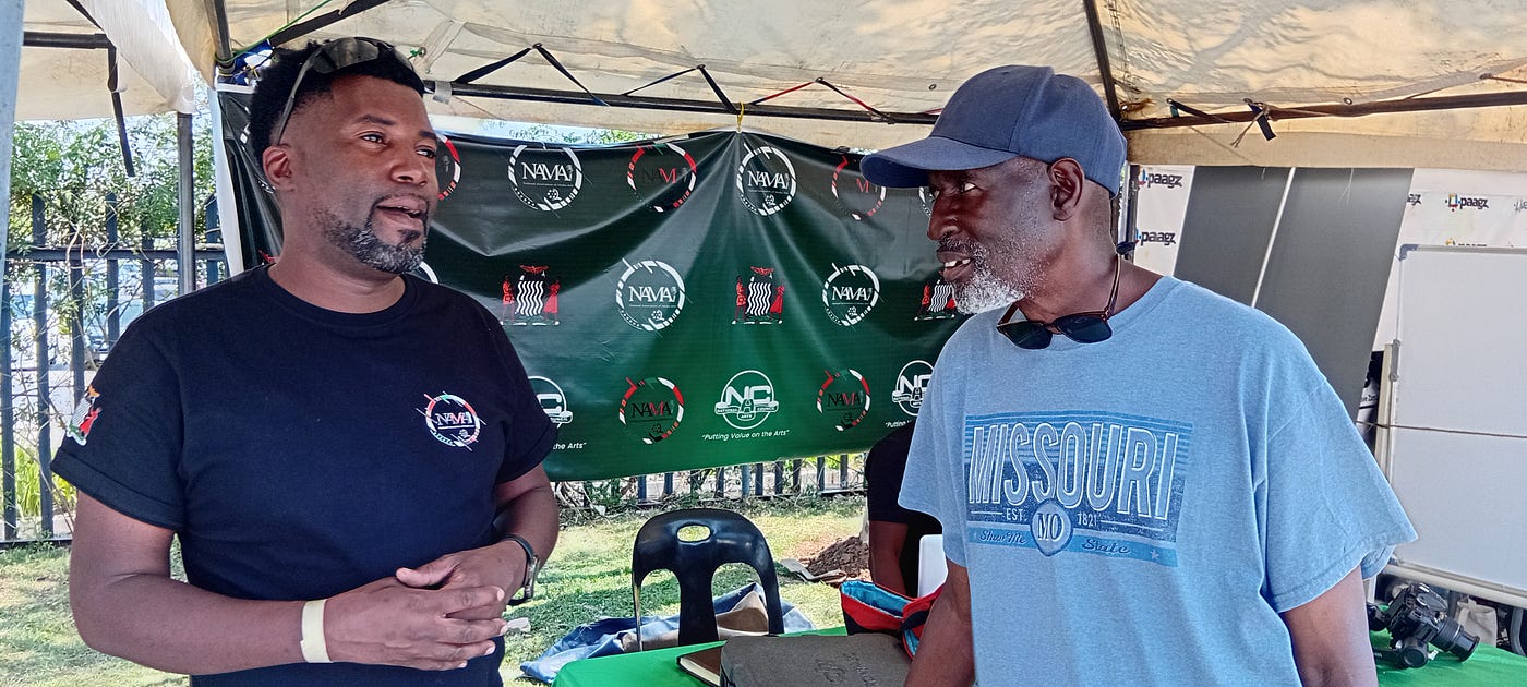 “Ice” Morgan Mbulo conversing with Chande Kapundu during the National Arts Festival (Photo Credit: Andrew-Knox Kaniki)