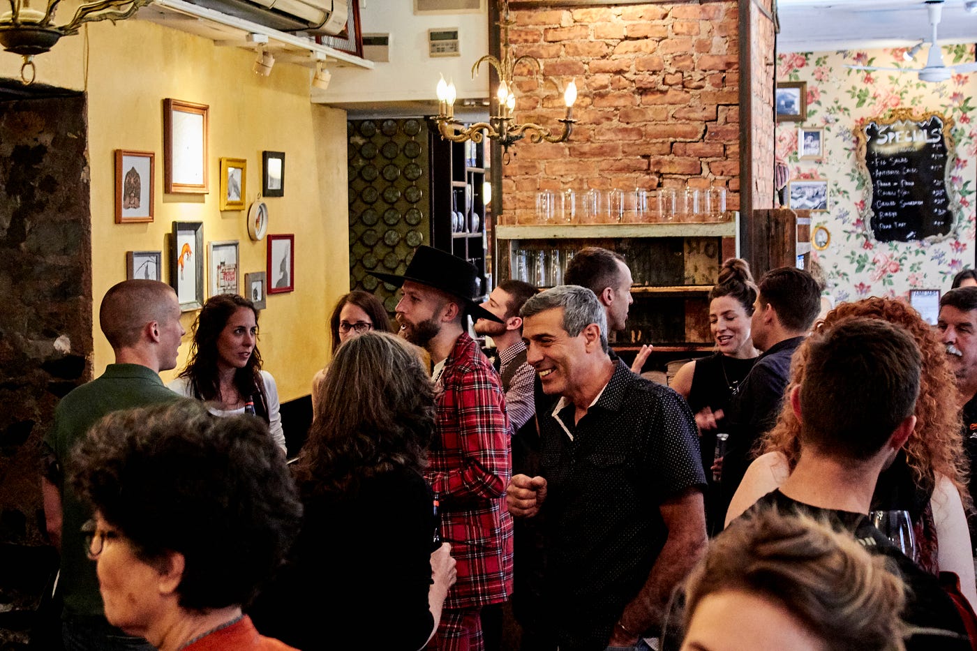 Co-owner Michael Forte, center, at an art opening hosted at Pisticci.