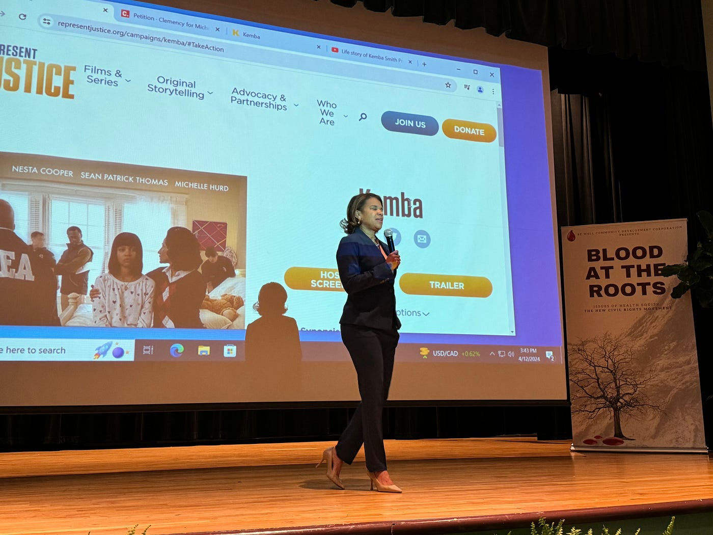 Kemba Smith Pradia speaking at a screening of “Kemba”.
