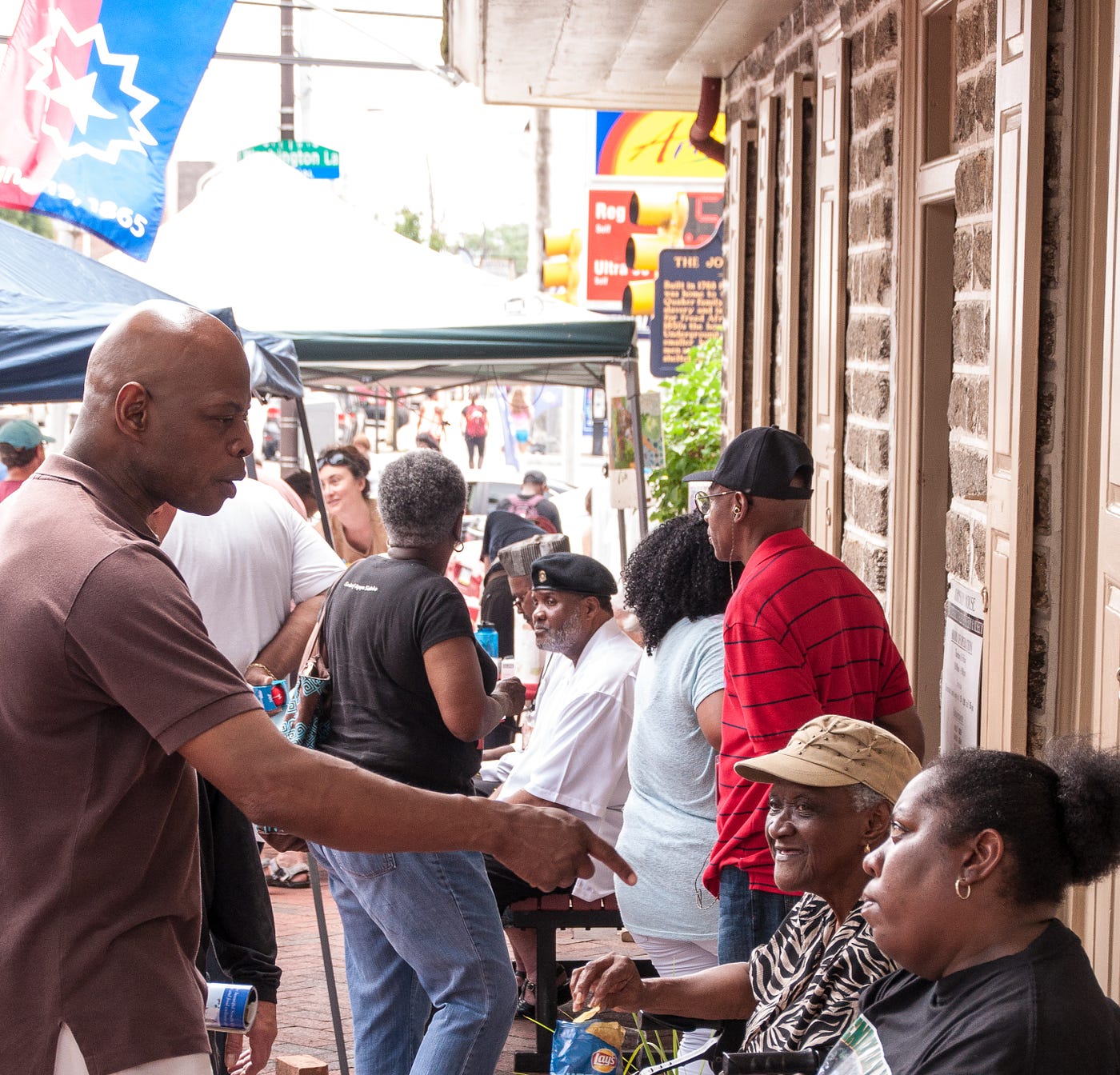 (Former) Pennsylvania state representative Stephen Kinsey chats with Festival goers gathered in front of the Johnson House Historic Site. Photographed by Tieshka Smith at the 11th annual Philadelphia Juneteenth Festival in Germantown, June 17, 2017. This image is protected by copyright.