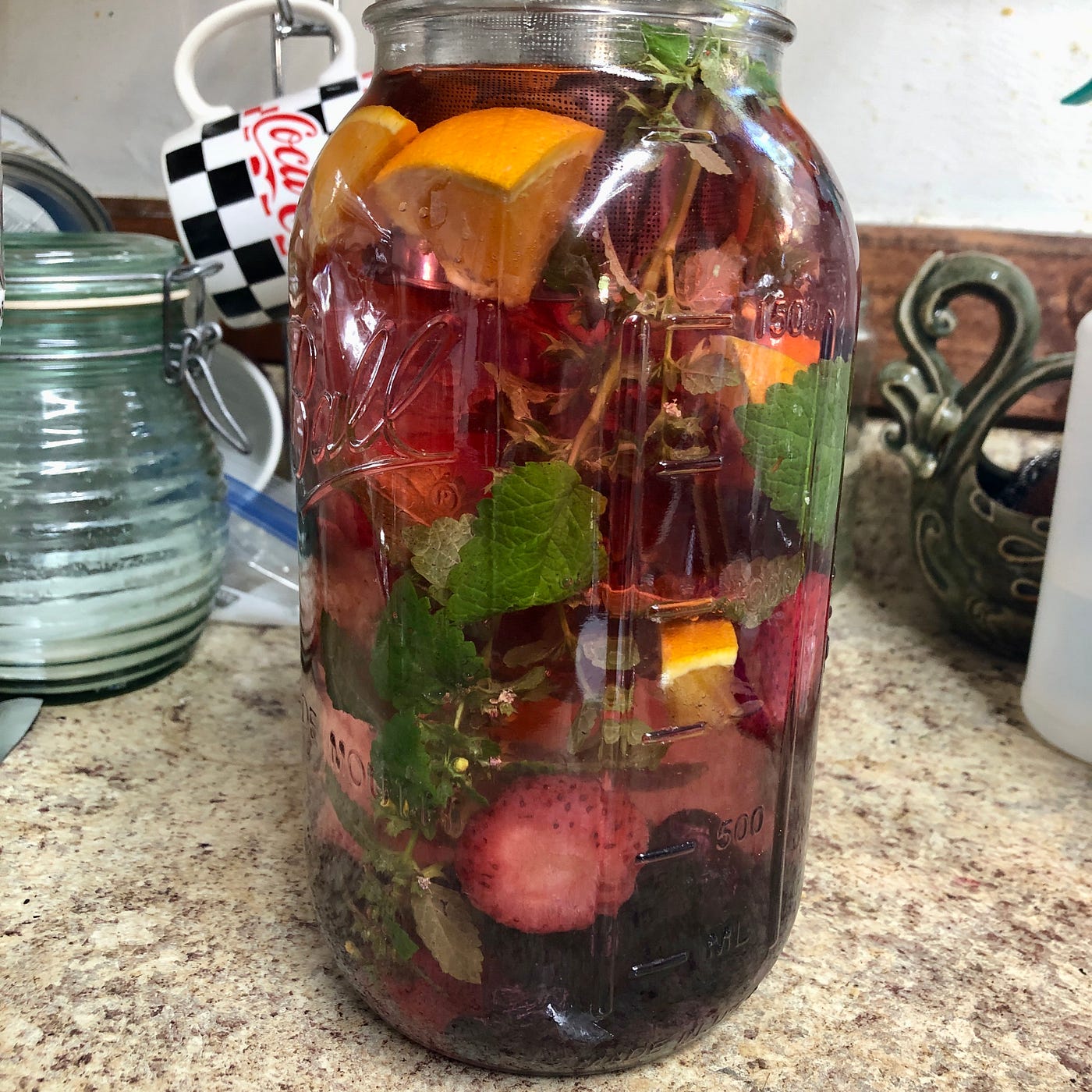 Hibiscus Ice Tea with fruit and lemon balm