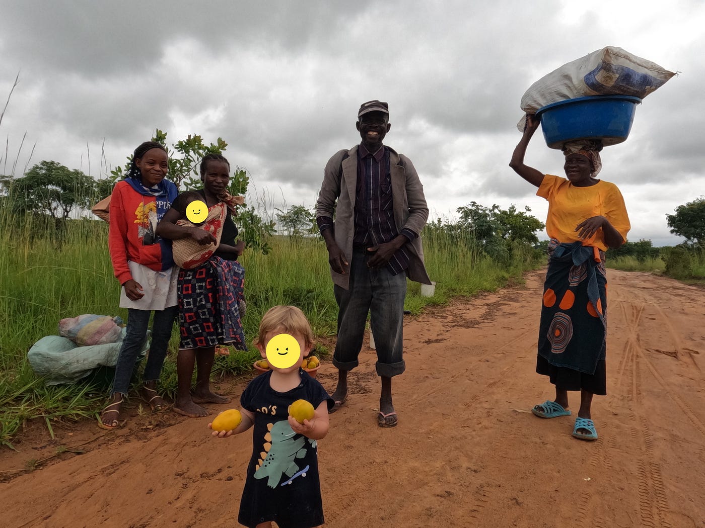 Eric receiving gifts from the locals walking into town. | Photo credit: Anne Bonfert